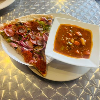 5. Manhattan clam chowder with a slice