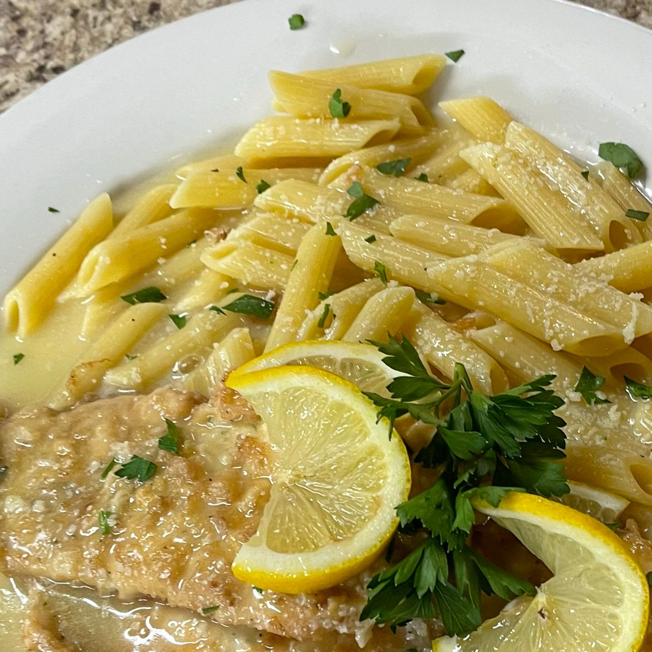 9. Chicken Francese over penne pasta.